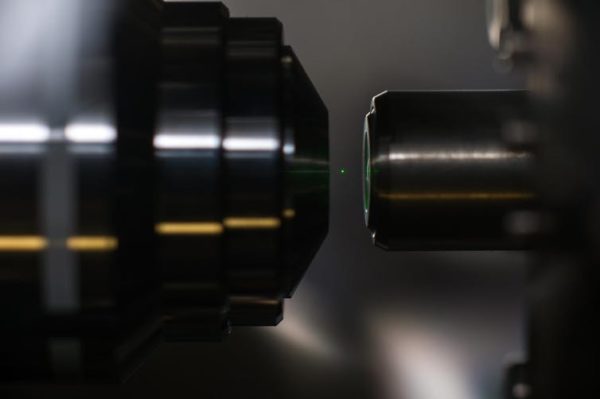 Experiments with optical tweezers race to test the laws of quantum mechanics